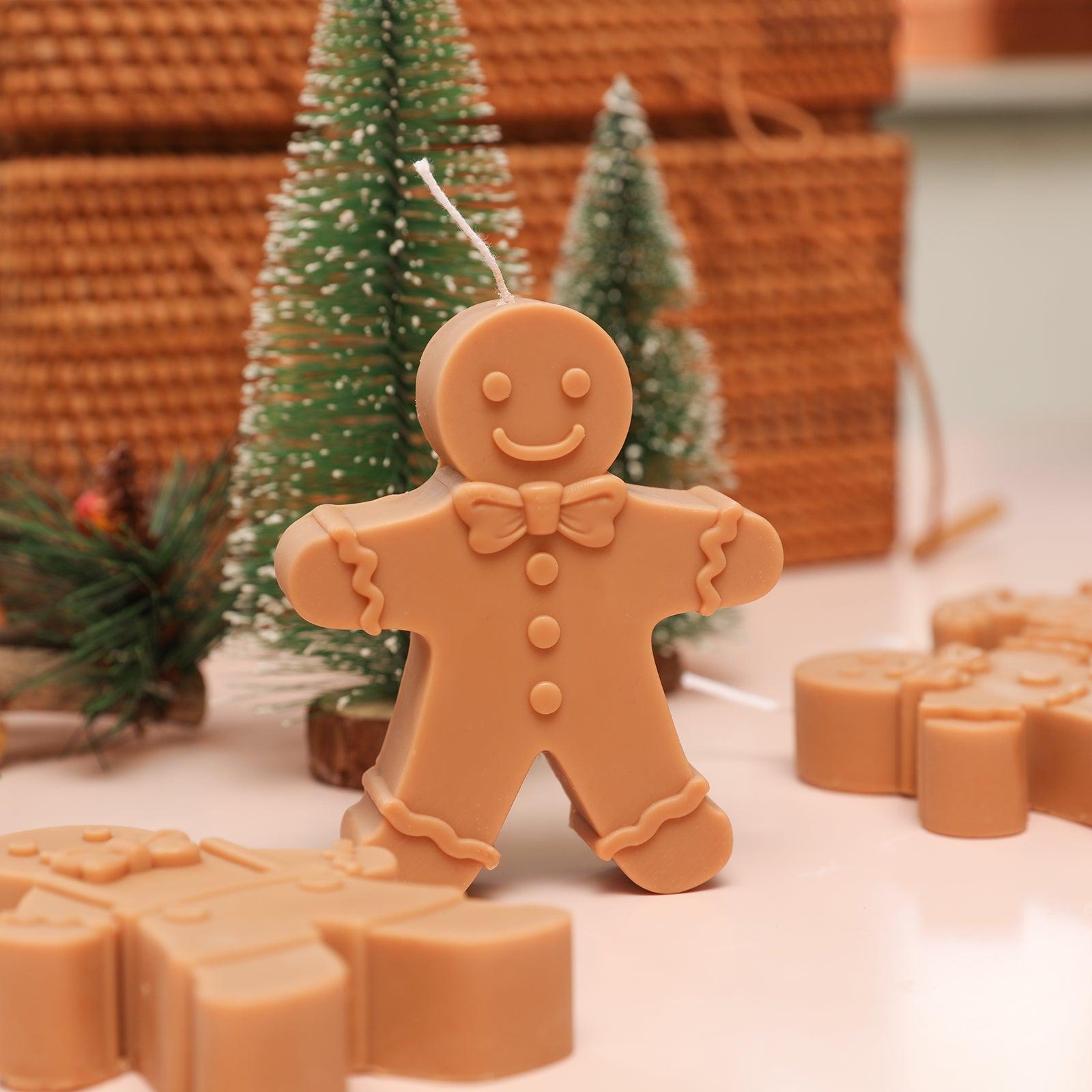 Brown Gingerbread Papa Candle placed on the table with Christmas tree decorations behind it - Boowan Nicole