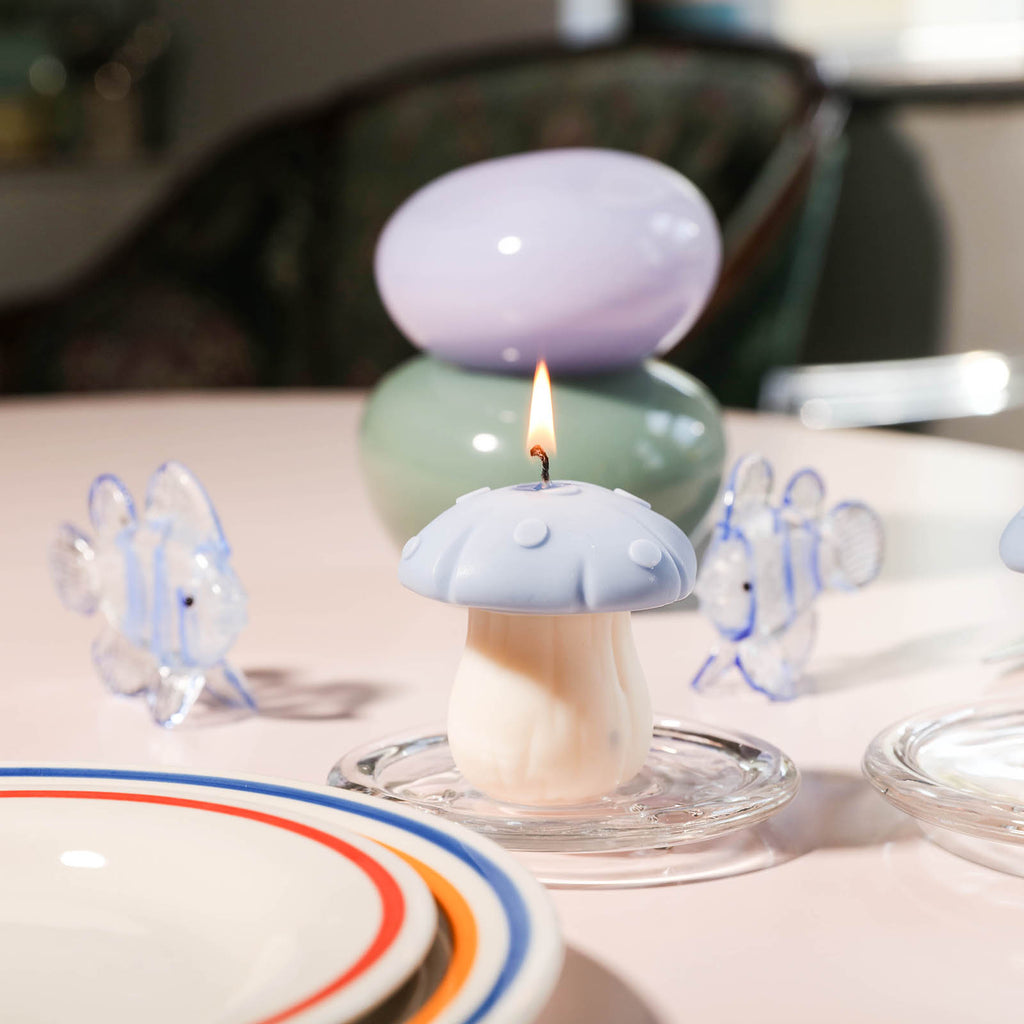 Light the purple toadstool candle on a crystal tray, designed by Boowan Nicole.