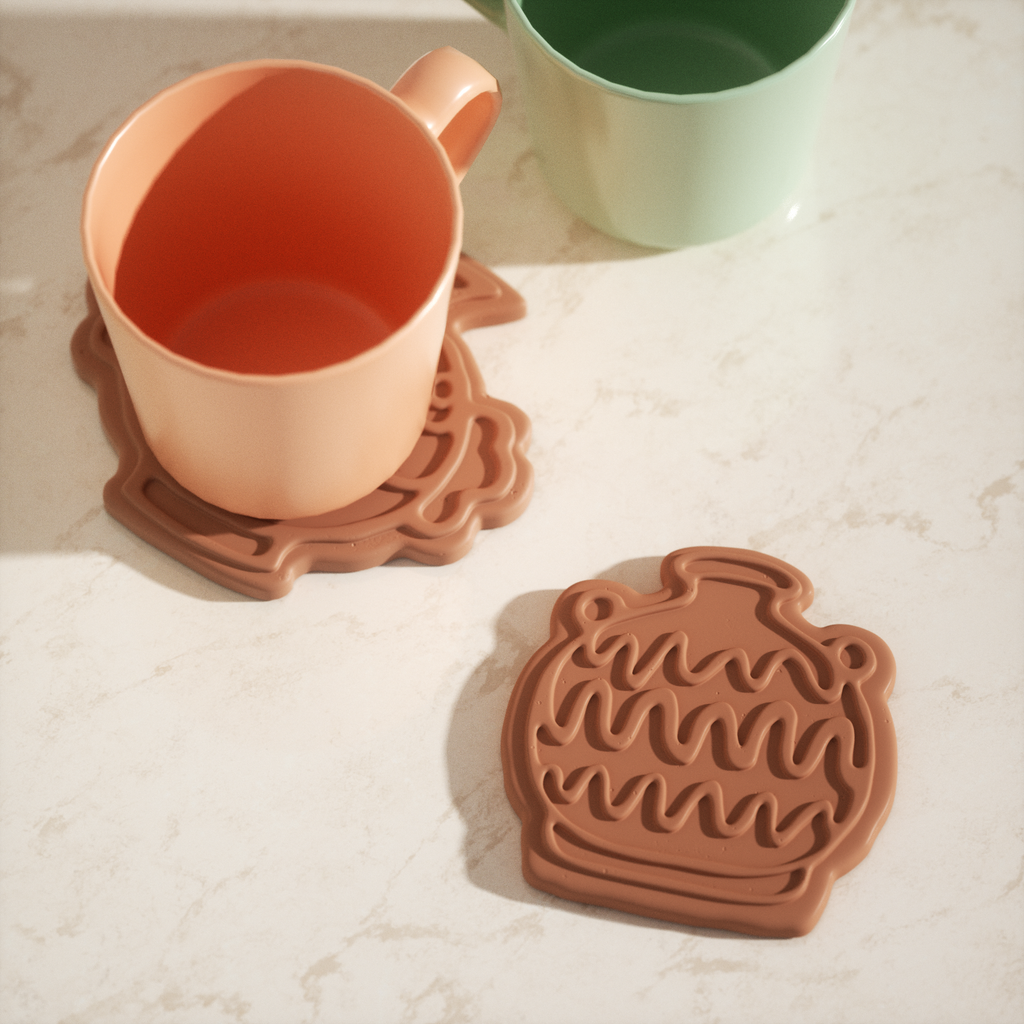 Red-brown amphora-shaped coasters are placed on the table, designed by Boowan Nicole.