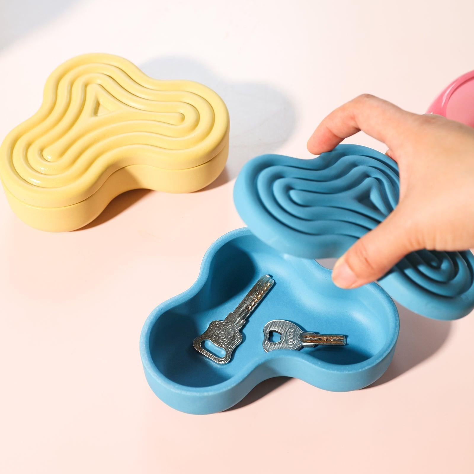 Blue wriggle candle jar holds keys - Boowan Nicole