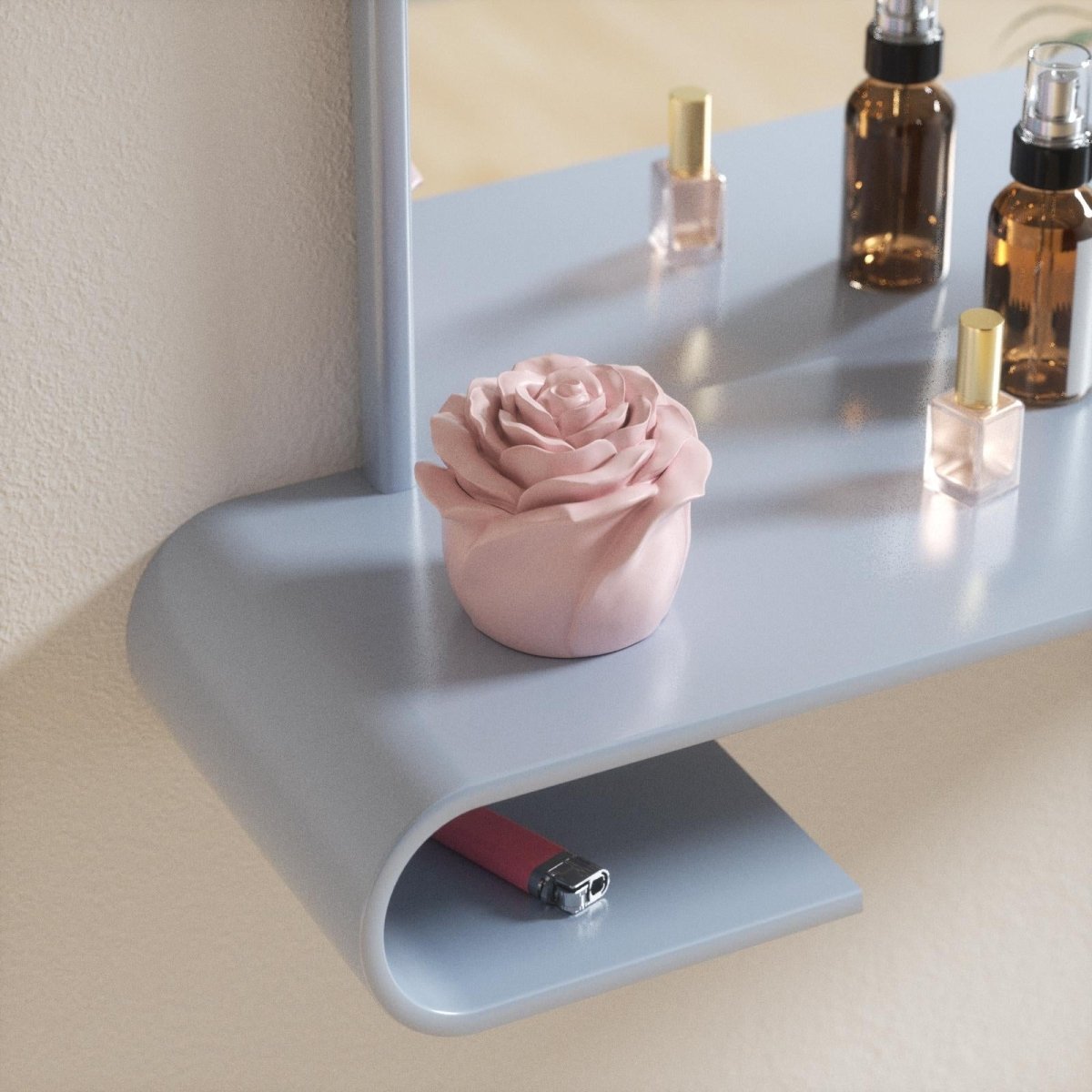 4oz rose-shaped candle jar placed on a light blue shelf, surrounded by perfume bottles, adding a soft decorative touch - Boowan Nicole