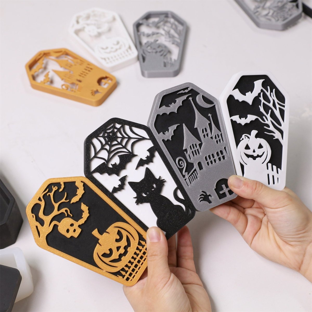 Halloween coffin candle jars with embossed spooky designs in assorted colors - Boowan Nicole