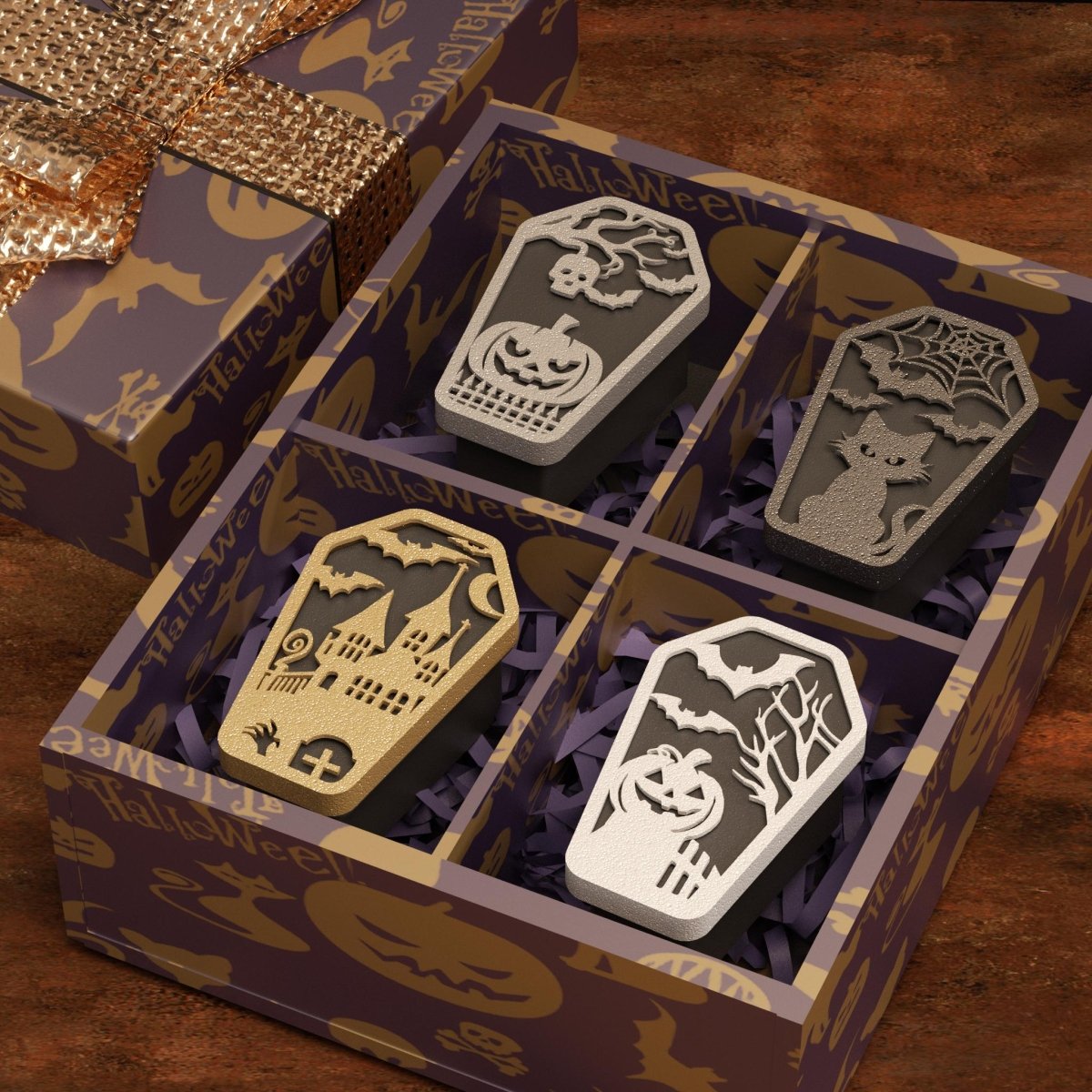 Halloween gift box with four coffin-shaped candles featuring pumpkin, cat, haunted house, and bat designs - Boowan Nicole