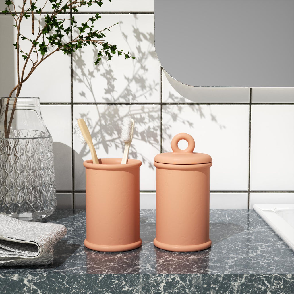 Candle jar with ring lid and orange cup with toothbrush -Boowan Nicole