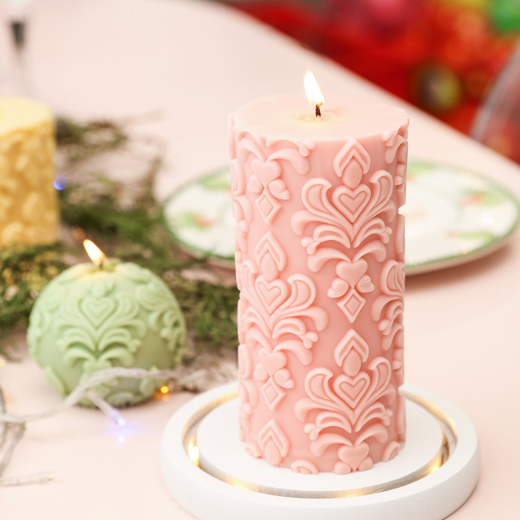 Vibrant pink relief patterned candle, adding a burst of color.