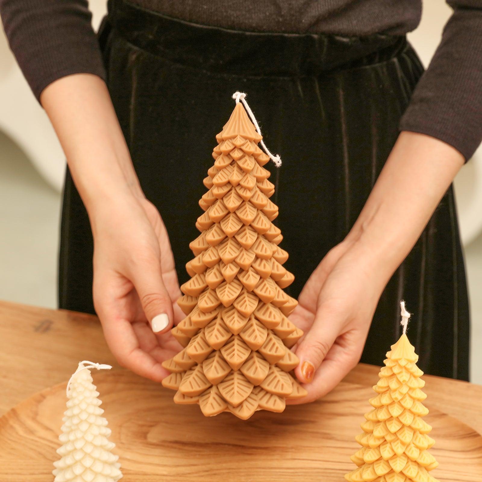 Hand holding display 8.5 inch brown Christmas pine candle - Boowan Nicole