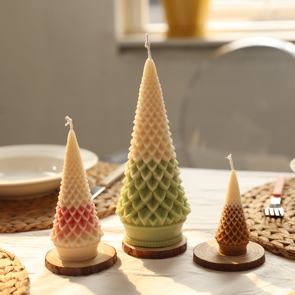 Three cone Christmas tree candles of different sizes placed on a wooden tray on the tabletop - Boowan Nicole