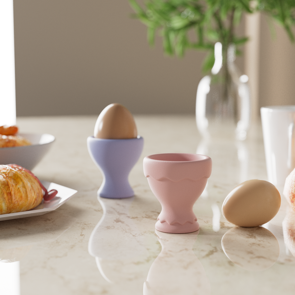 Two egg cups placed on a dining table.