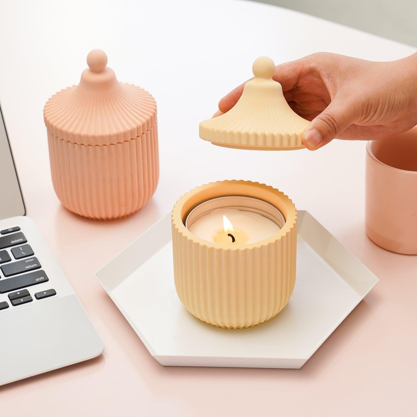 Place a candle jar in a tray next to your computer. The lighted flame can dispel the stress and fatigue of work.