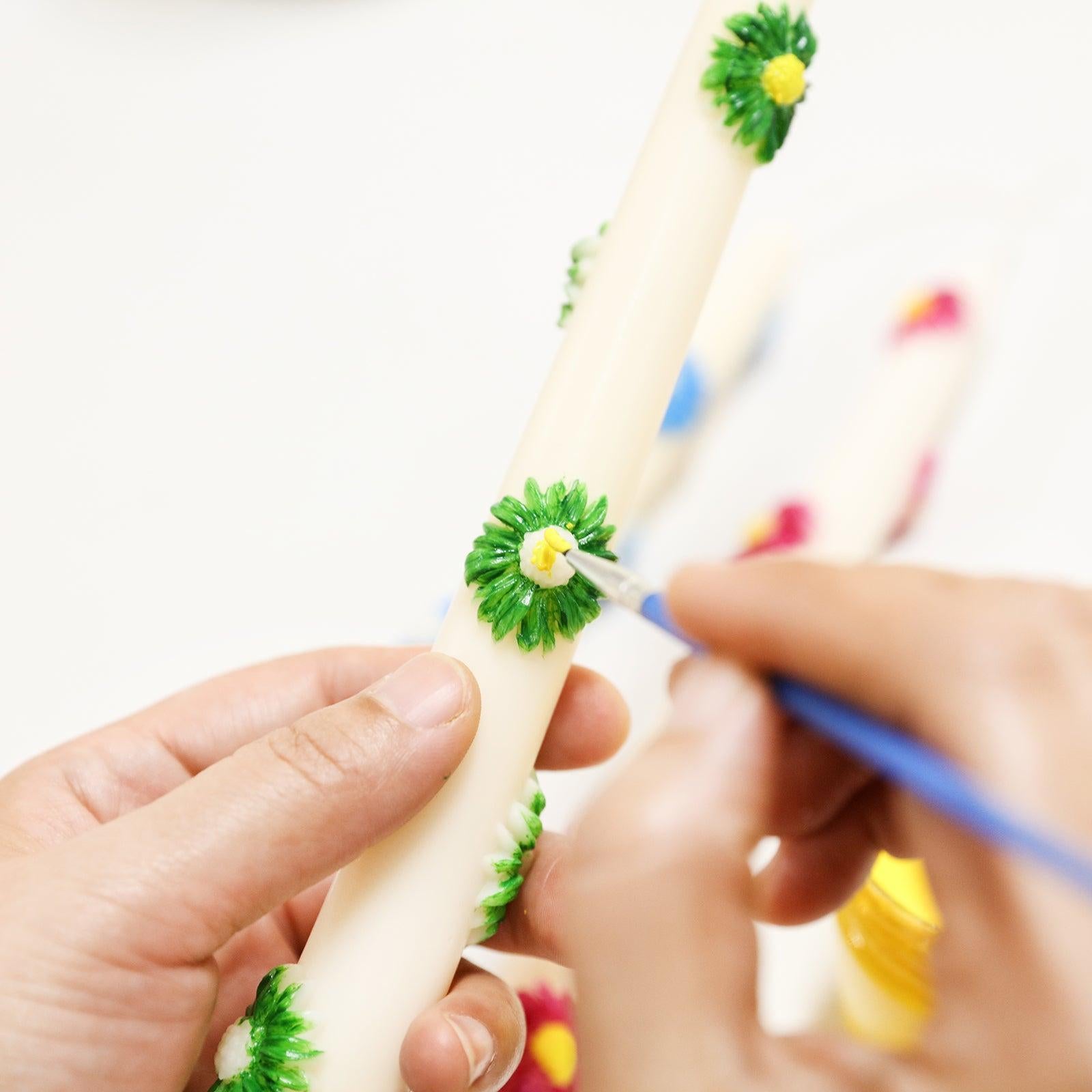 Color the daisies on the taper candle, designed by Boowan Nicole.