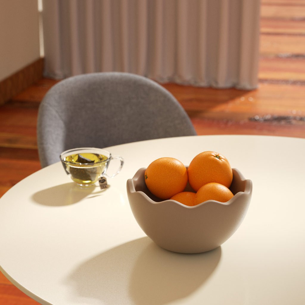 Eggshell bowl with oranges on the table with a cup of tea next to it