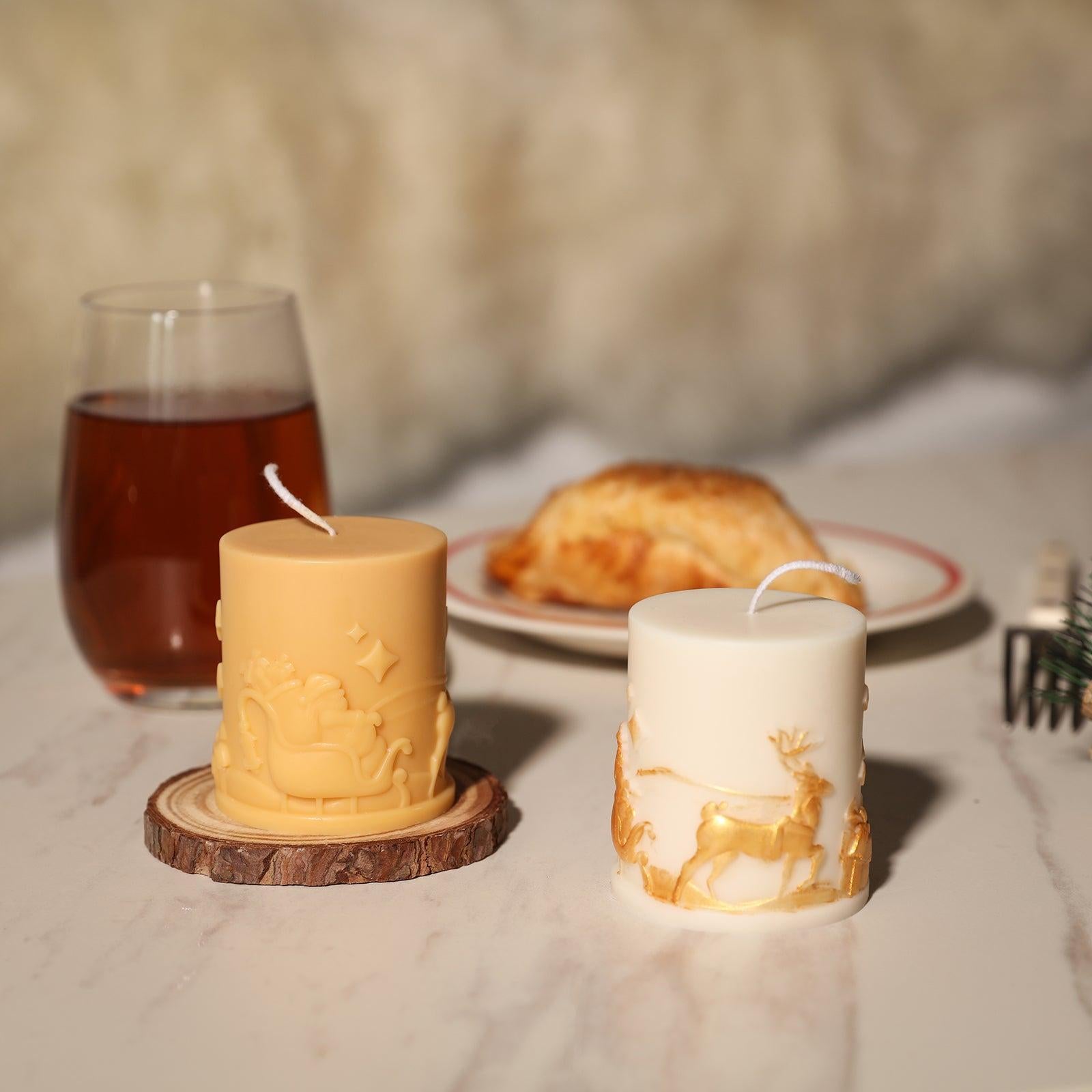 Yellow and gold mica pink Christmas pattern embossed pillar candles on the dining table - Boowan Nicole