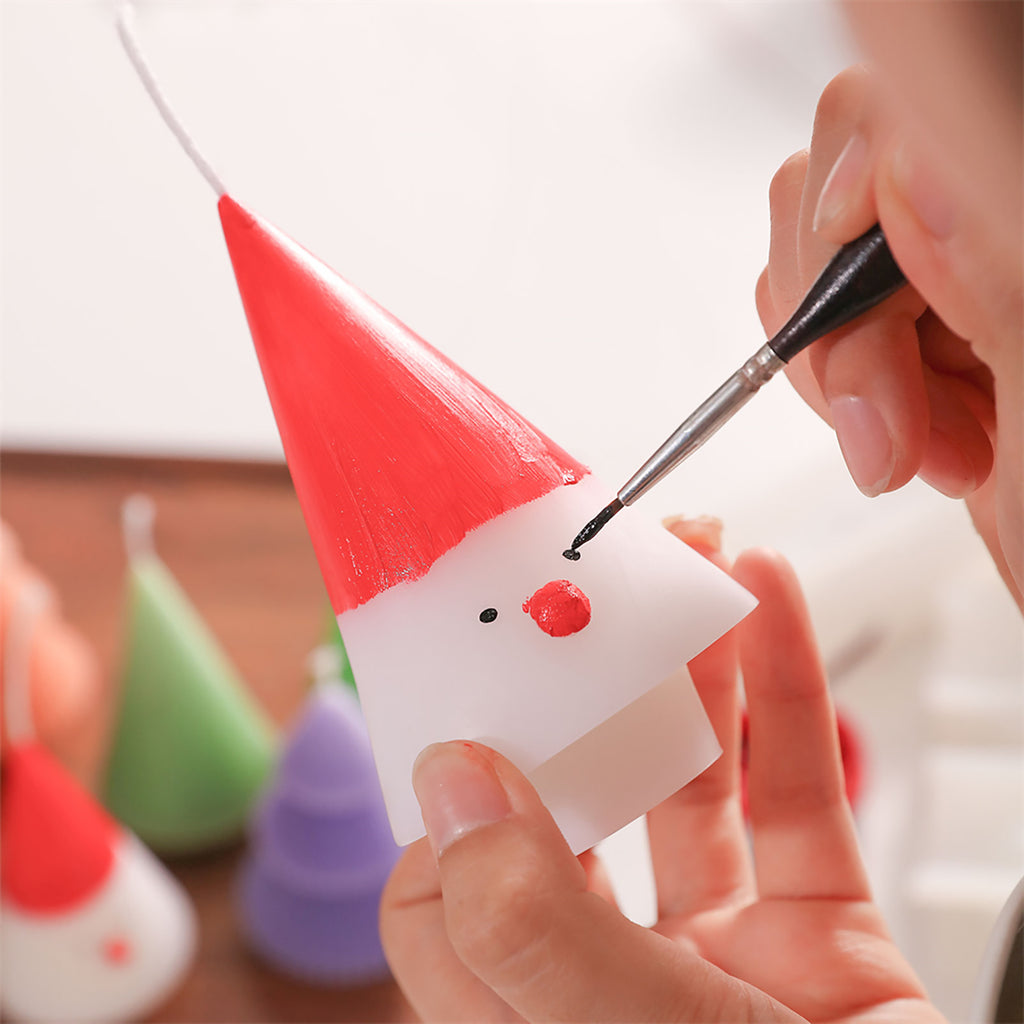 Draw a Christmas snowman on white conical Christmas tree candles - Boowan Nicole