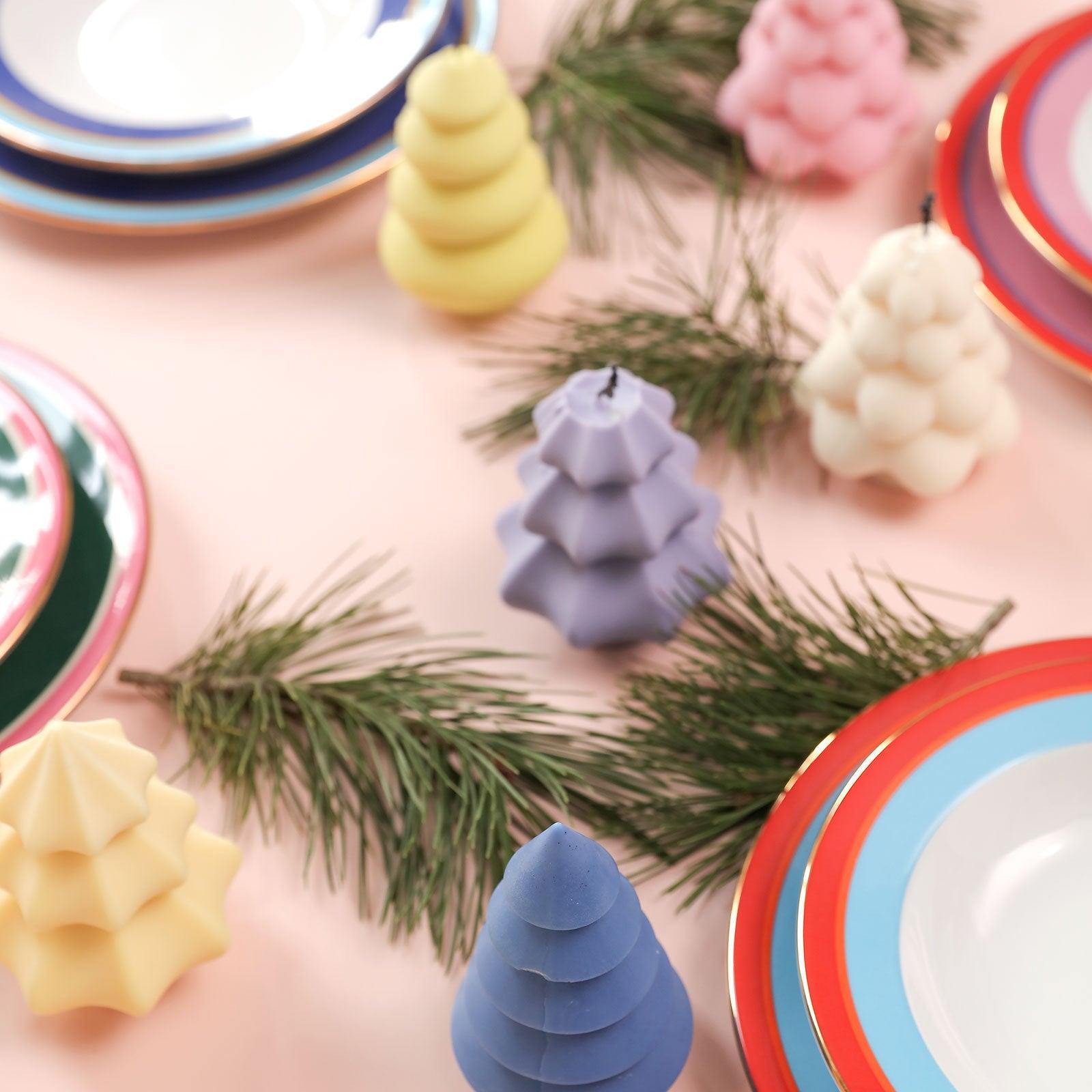 Christmas tree shaped candles on the dining table-Boowan Nicole