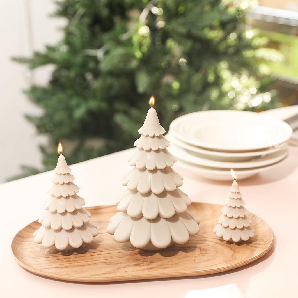 Three tiered Christmas tree candles in cream color on tray, designed by Boowan Nicole.