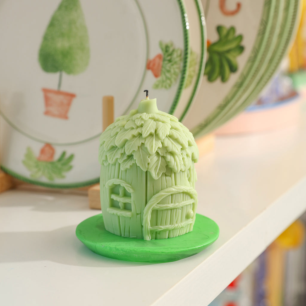 Green miniature fairy house candles are placed on the bookshelf to add decoration to life-Boowan Nicole