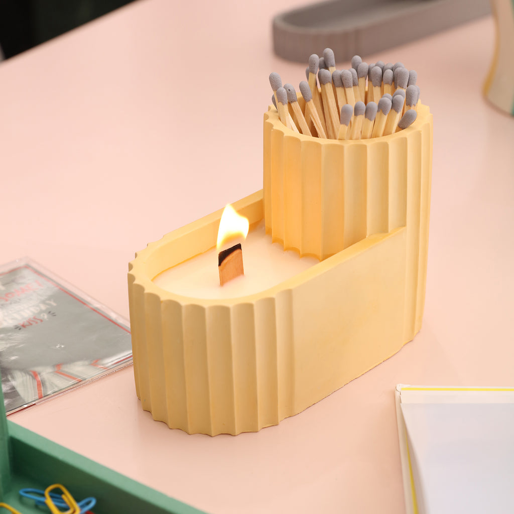 Light the candle in the Tall Pen Holder with a match next to it - Boowan Nicole
