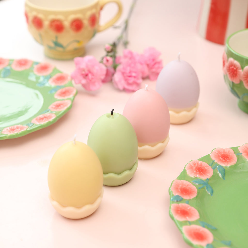 Collection of Easter egg candles in four vibrant colors.