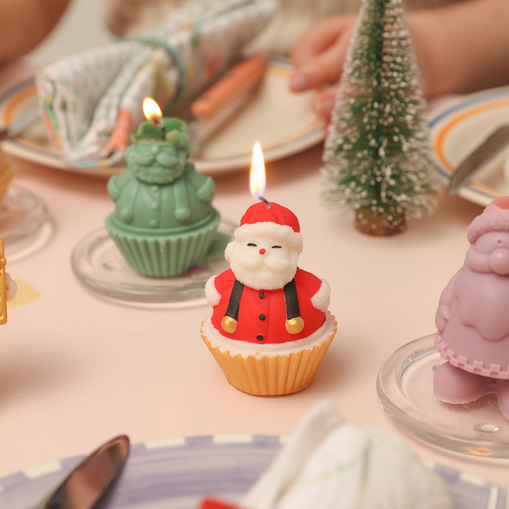 Lighting the Santa Claus Cupcake Candle on the tabletop that has been decorated with coloured pencils - Boowan Nicole