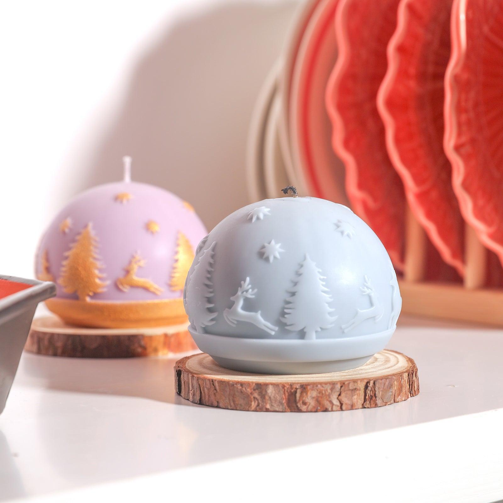 Purple ball-shaped Christmas pattern candle in a log tray designed by Boowan Nicole.