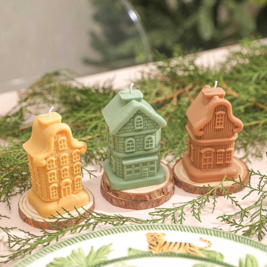 Three types of Sweet Home candles, respectively yellow, green, and brown.