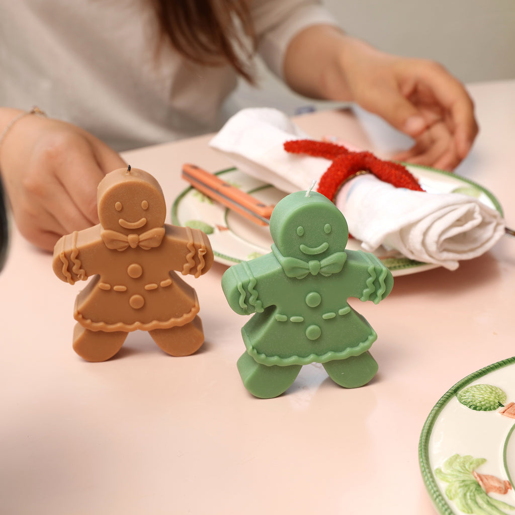 The brown and green Gingerbread Mama Candle is placed on the dining table to add a festive atmosphere - Boowan Nicole