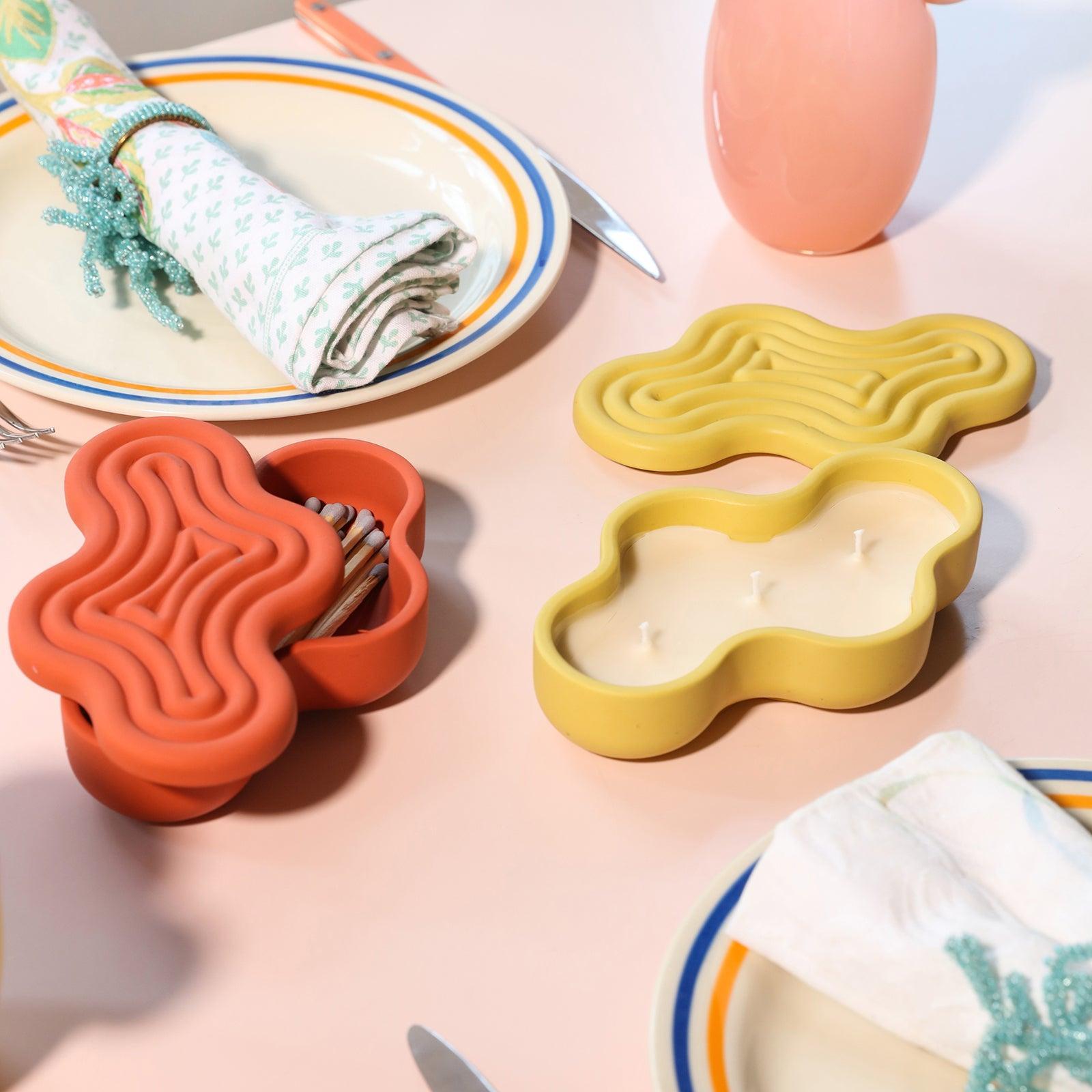 Matches are placed in the red Wriggle storage box, and candles are placed in the yellow Wriggle storage box - Boowan Nicole