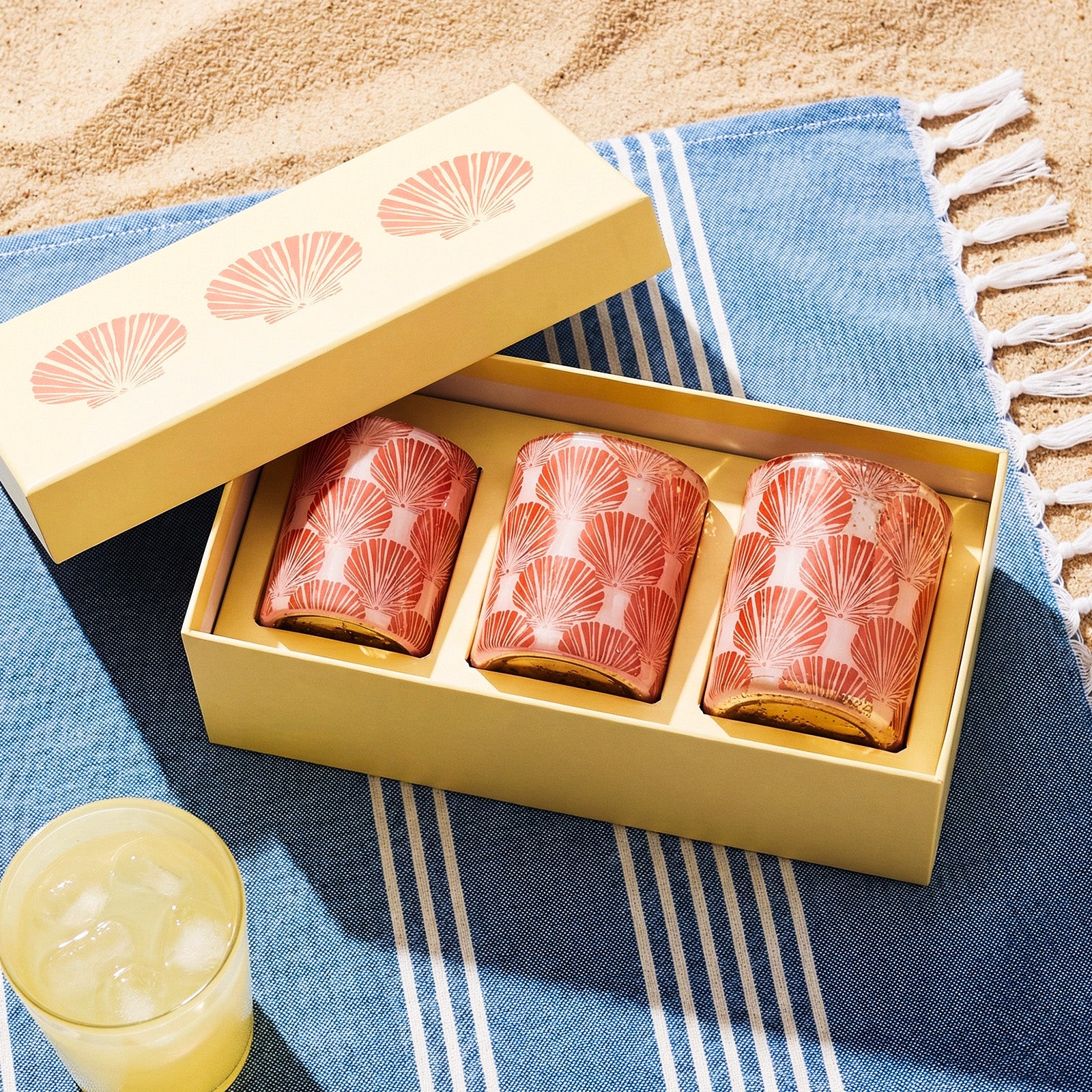 Three-Piece Coastal Fan Shell Candle Jar Set Packaged in Matching Printed Yellow Gift Box on Beach Towel - Boowan Nicole