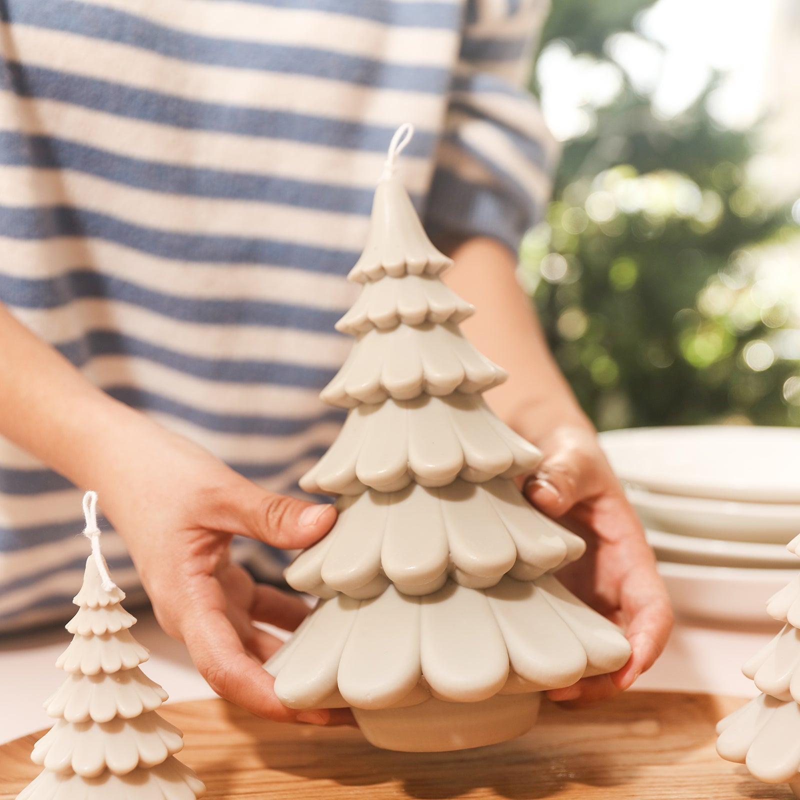 Arrange the 8.5-inch tiered Christmas tree candles in a tray, designed by Boowan Nicole.