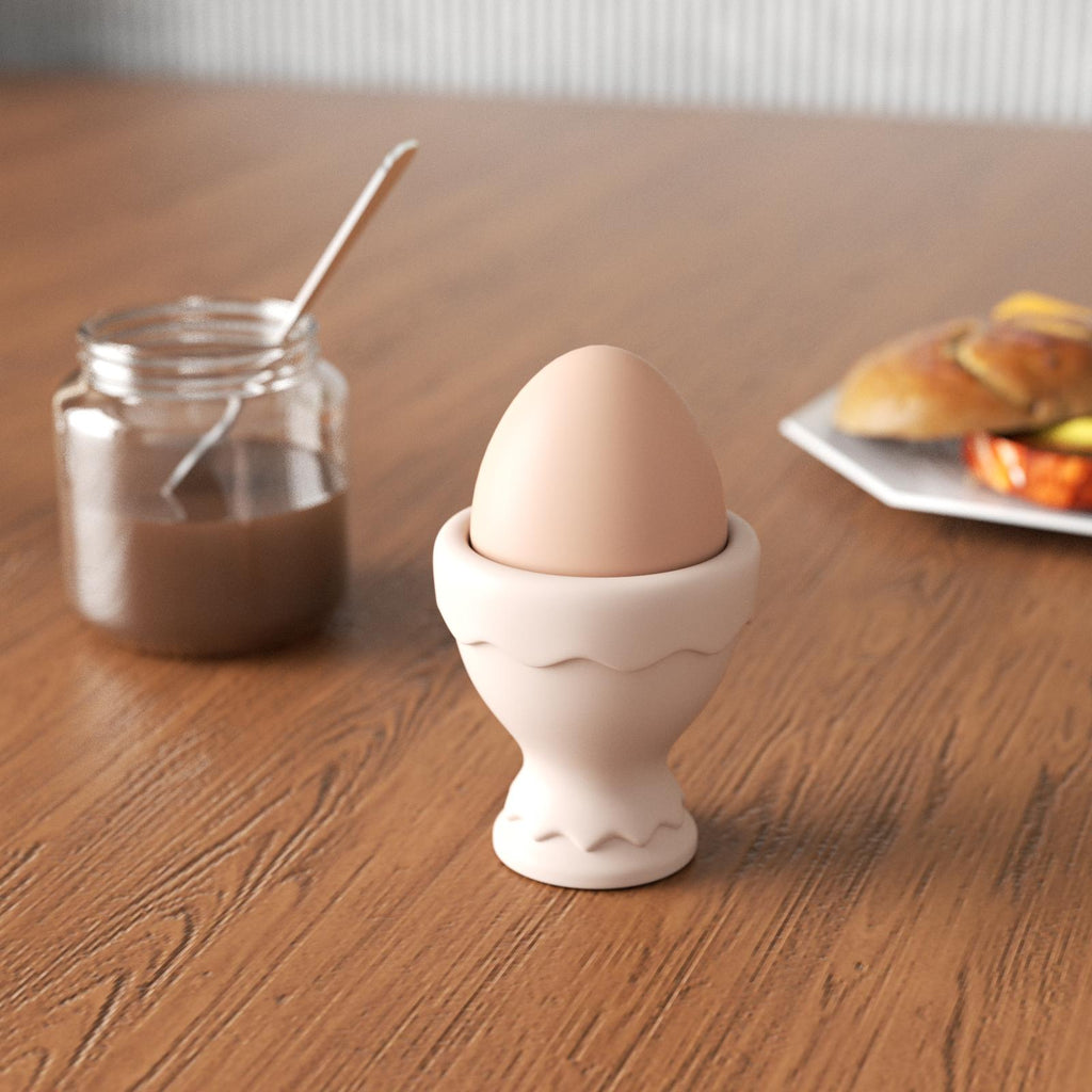 Breakfast table featuring eggs served in egg cups.