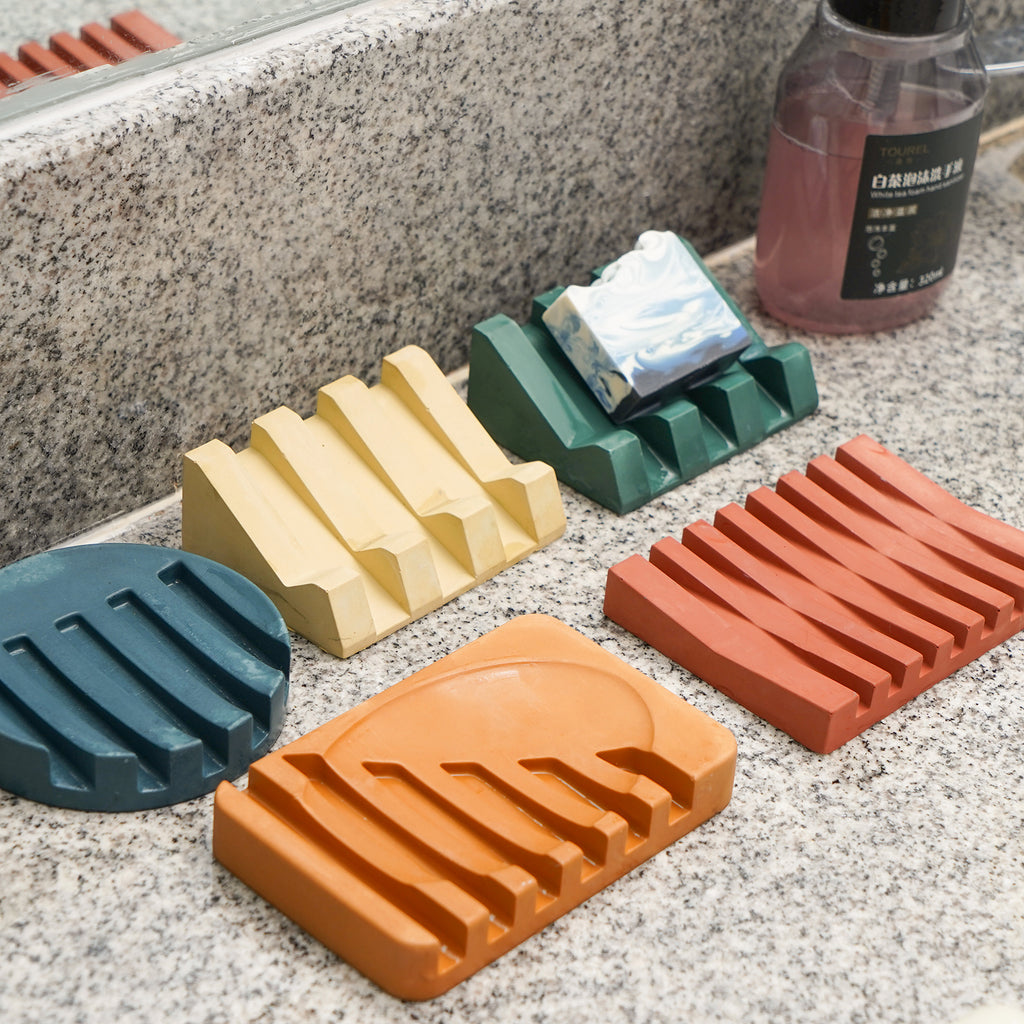 Transform your washing area with creativity – five soap dishes in diverse shapes and colors, enhancing the charm of your sink space.