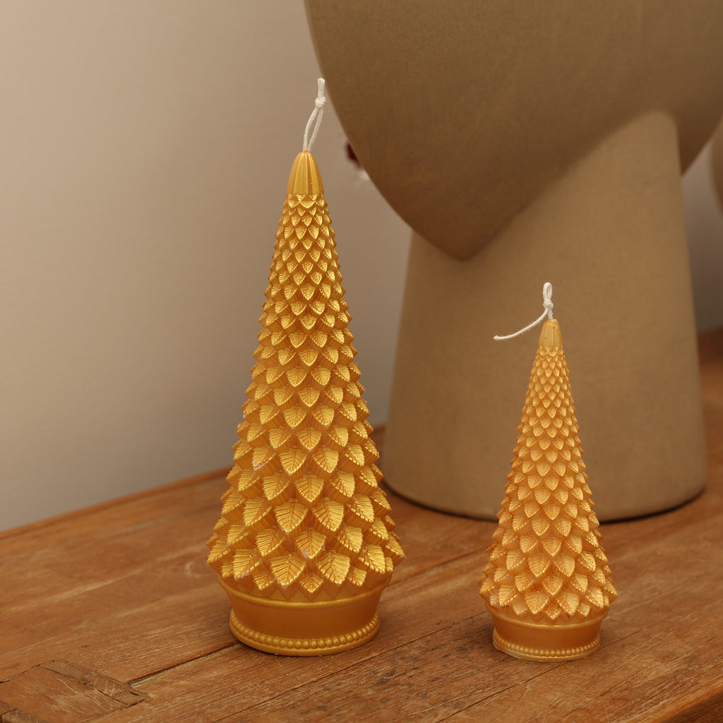 Two tapered Christmas tree candles, one large and one small, painted with golden mica powder-Boowan Nicole