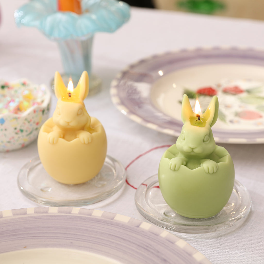 Yellow and green Easter candles being lit
