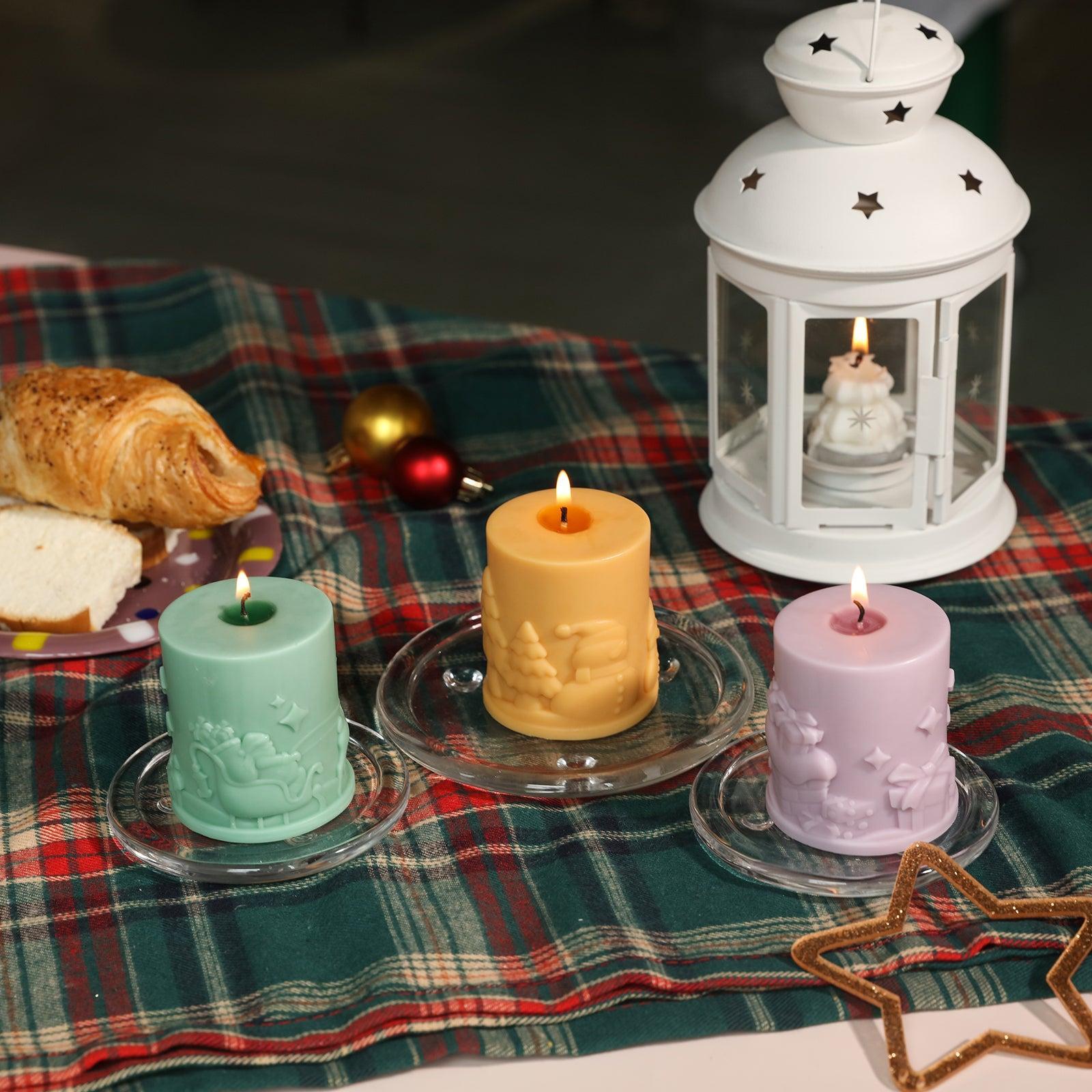 Green, yellow and purple Christmas themed embossed pillar candles in a crystal tray on the table - Boowan Nicole