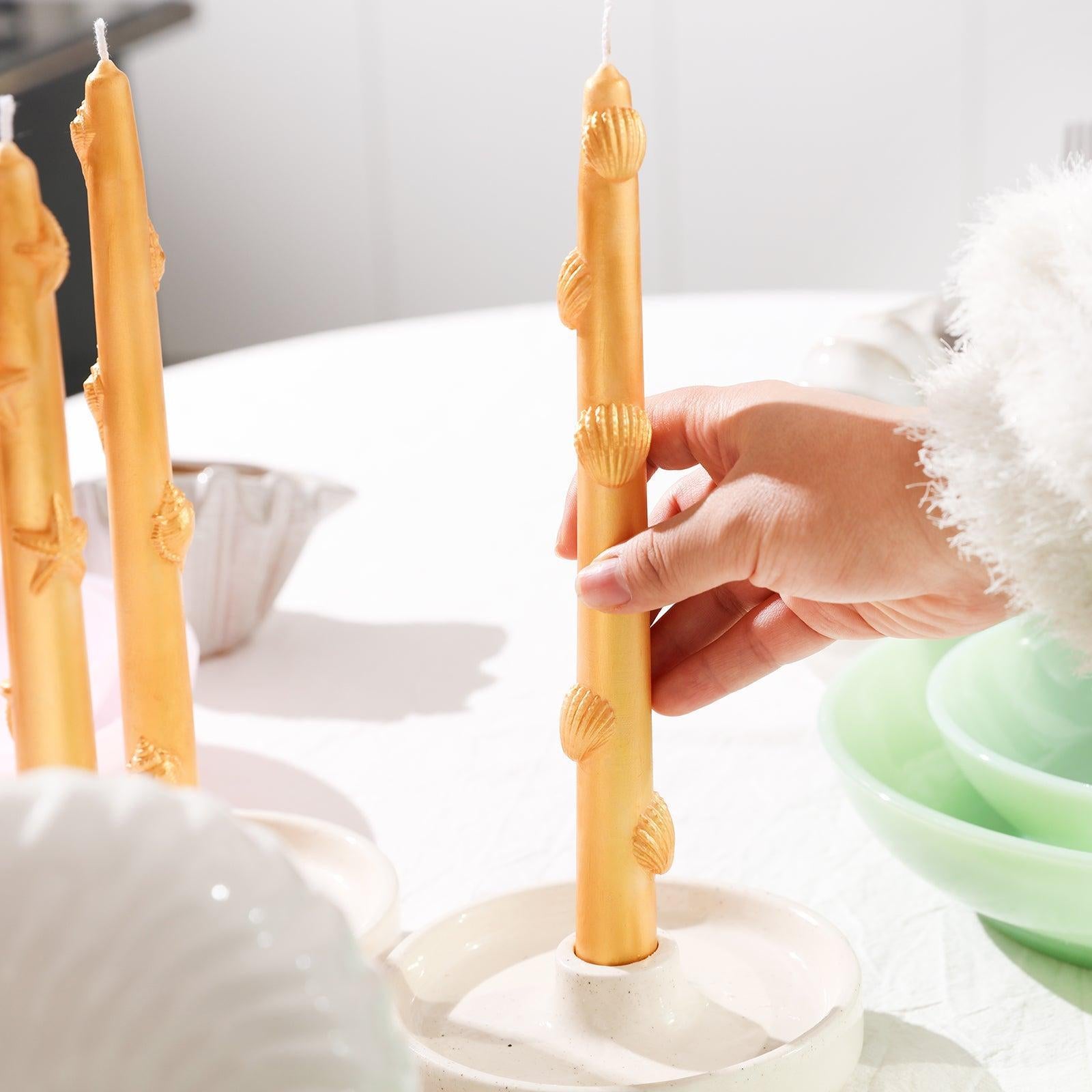 Ocean collection taper candle painted in golden mica powder.