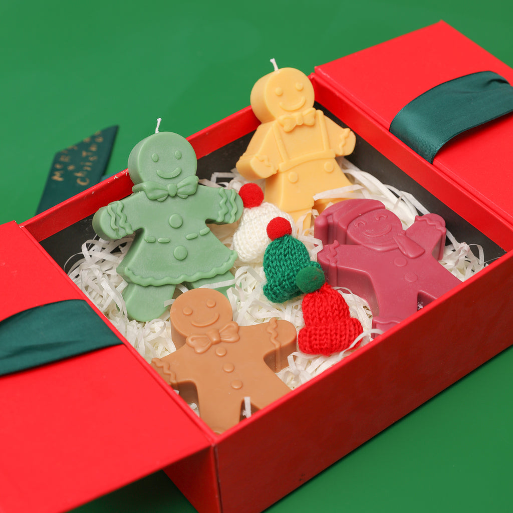 Gingerbread man candle in a gift box, designed by Boowan Nciole.