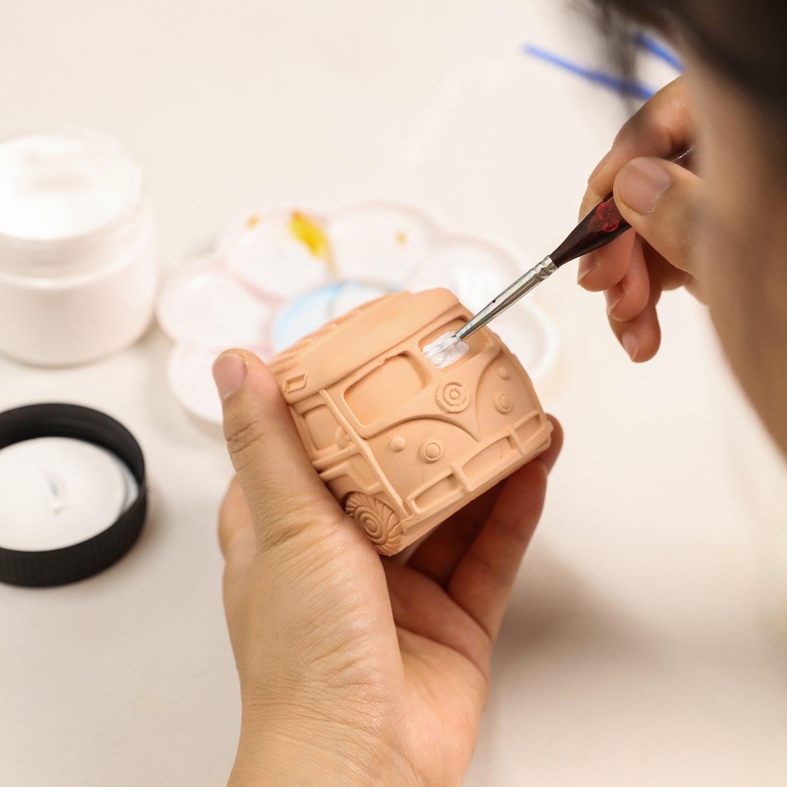 Use a paintbrush to color the Kombi Vintage Camper Van Candle - Boowan Nicole