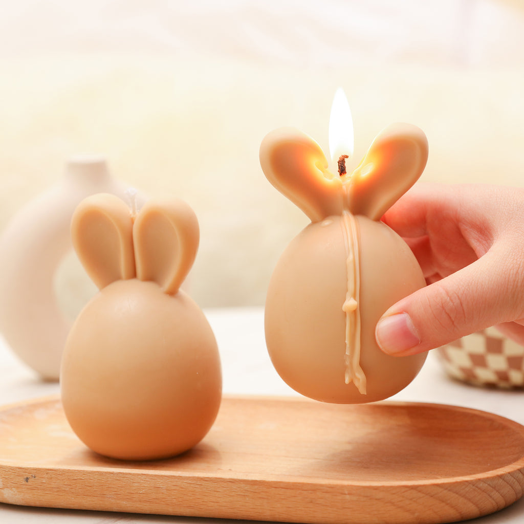 Bunny Candle burning, creating a cozy atmosphere.