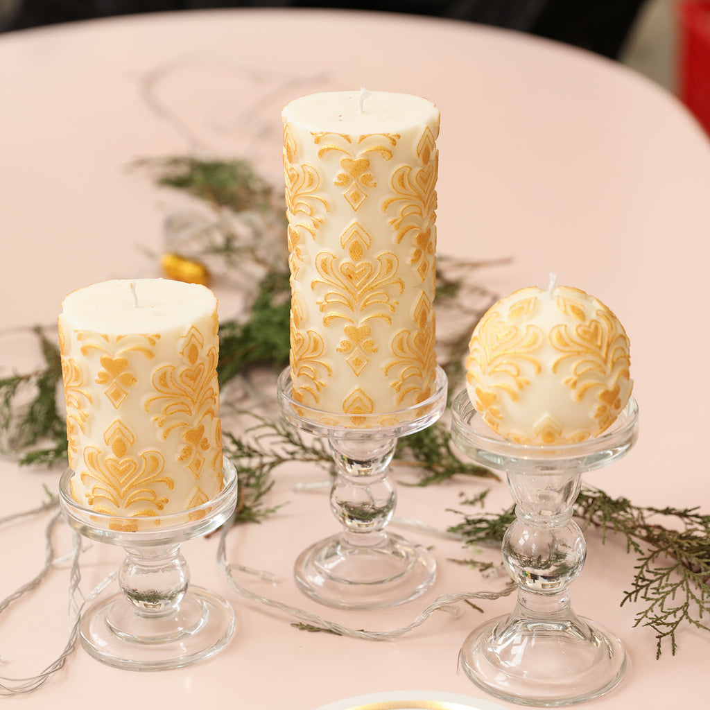 White relief patterned short, ball, and tall candles, each showcasing its unique charm.
