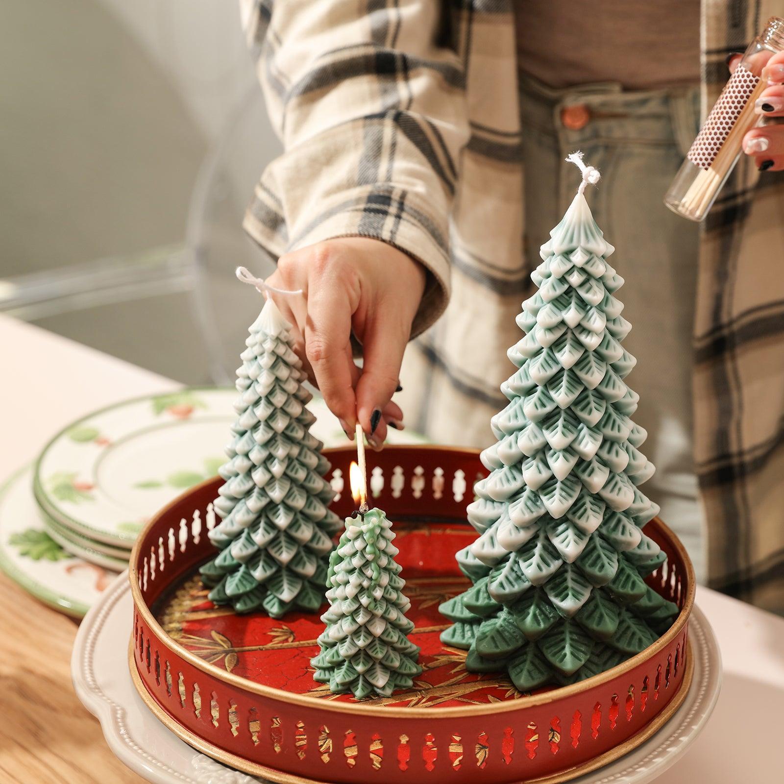 Lighting green and white Christmas candles in tray with green and white Christmas candles of different sizes next to them - Boowan Nicole