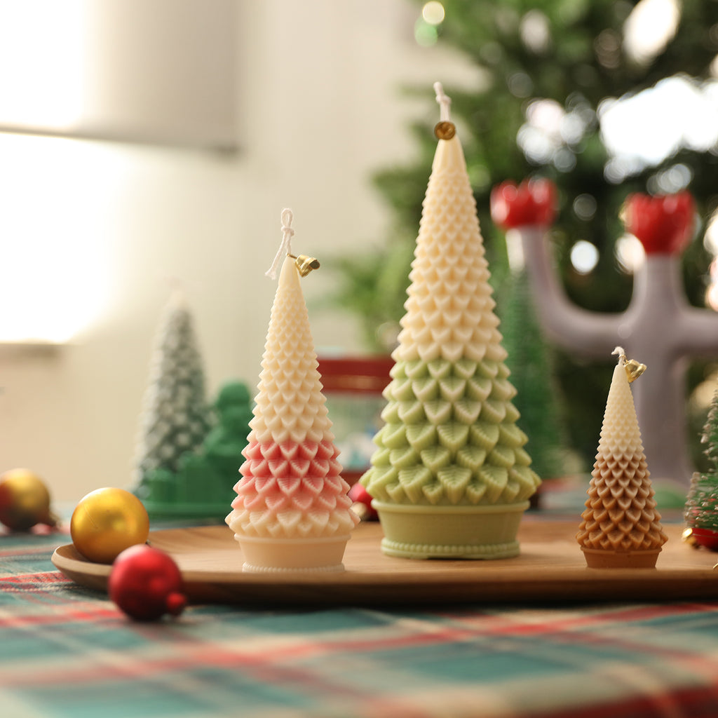 Three Christmas tree candles of different sizes placed on a tray - Boowan Nicole