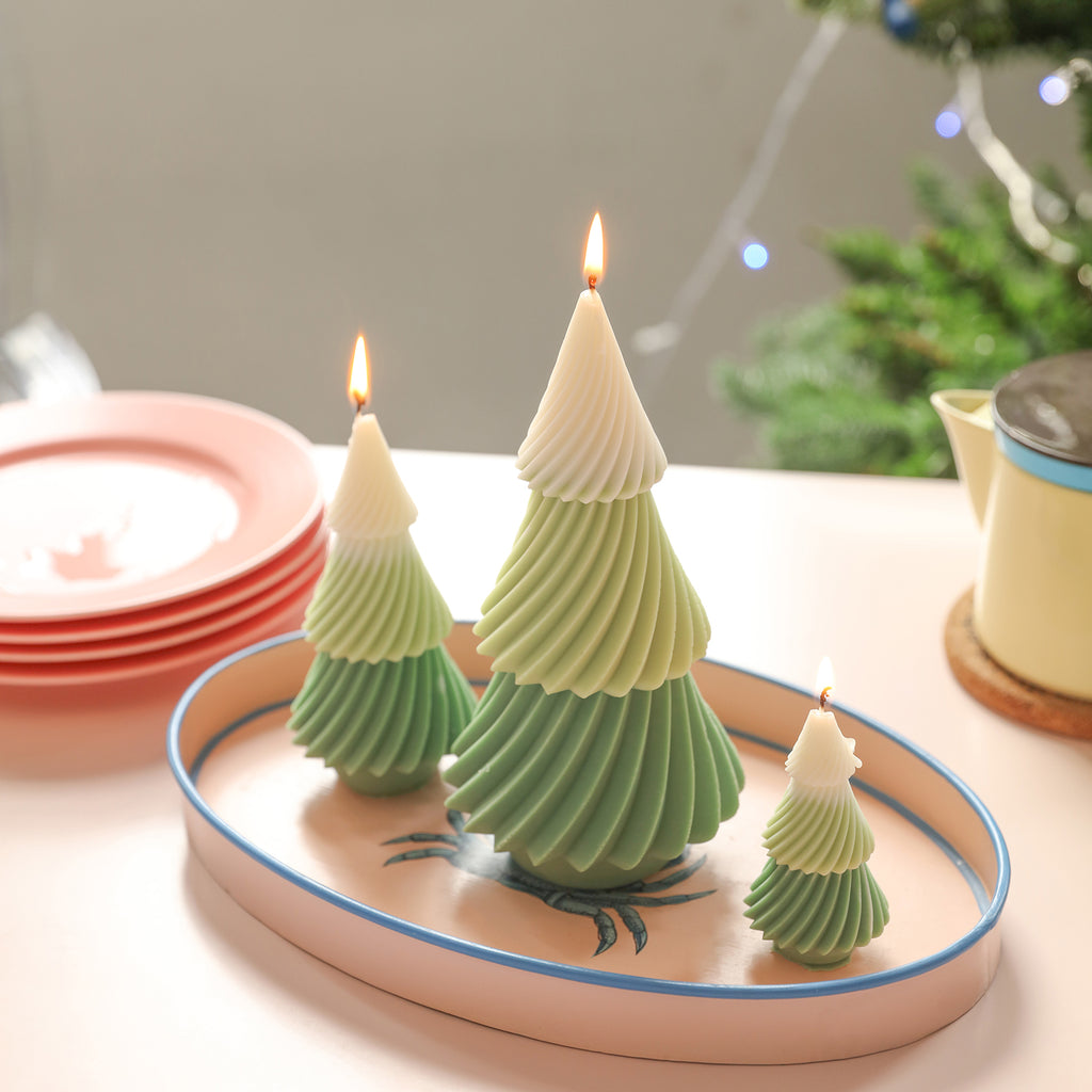 Three Christmas tree candles of different sizes placed on a tray - Boowan Nicole