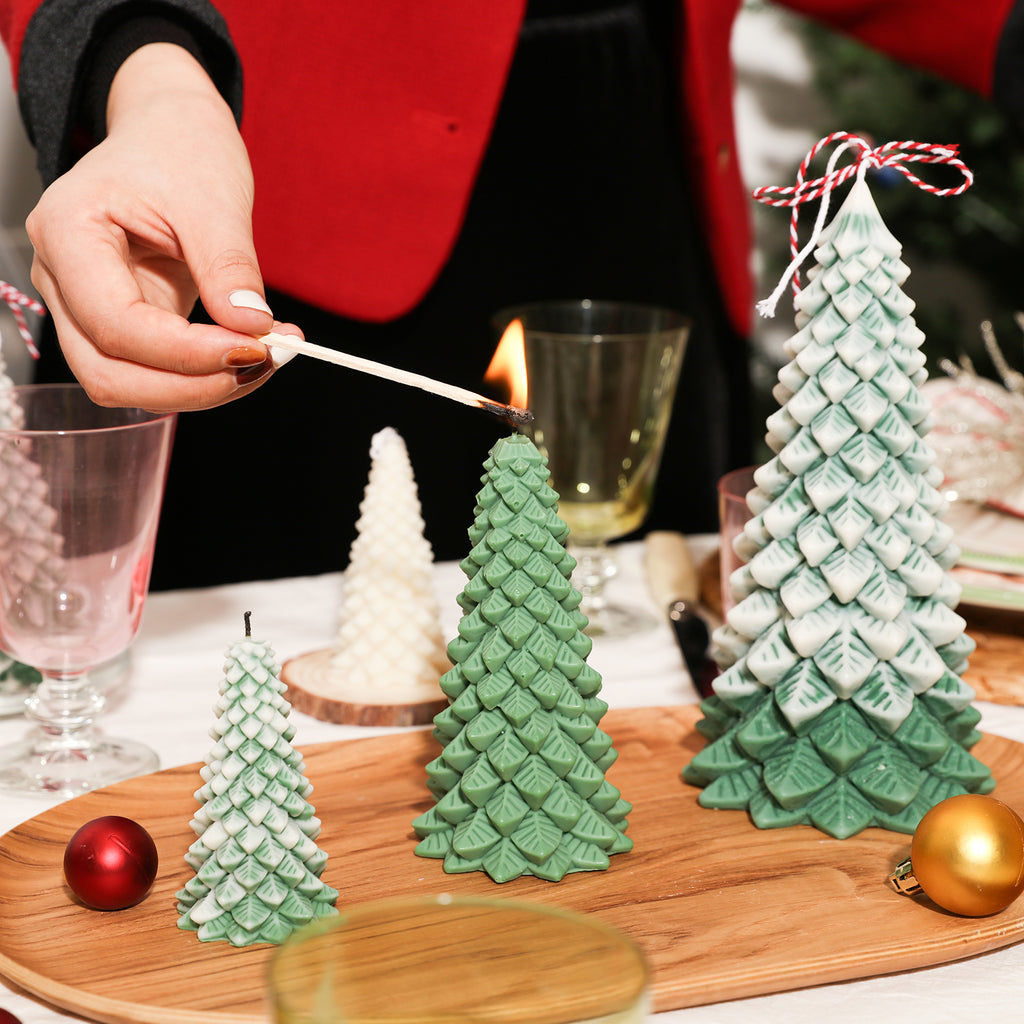 Light a 6-inch Christmas pine candle on the dining table with Christmas decorations next to it - Boowan Nicole