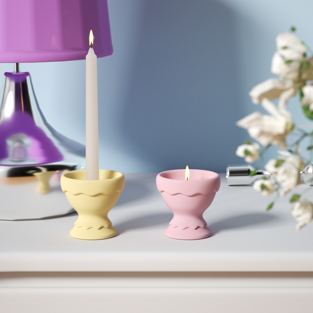 Radiant scene featuring burning tapered candles on a yellow candle holder and tea light candles in a blue candle holder.