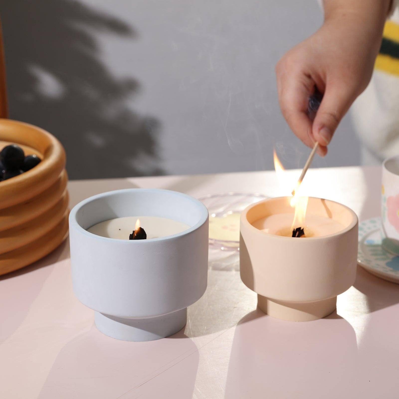 Sequential lighting of candles in blue and yellow boowannicole candle jars.