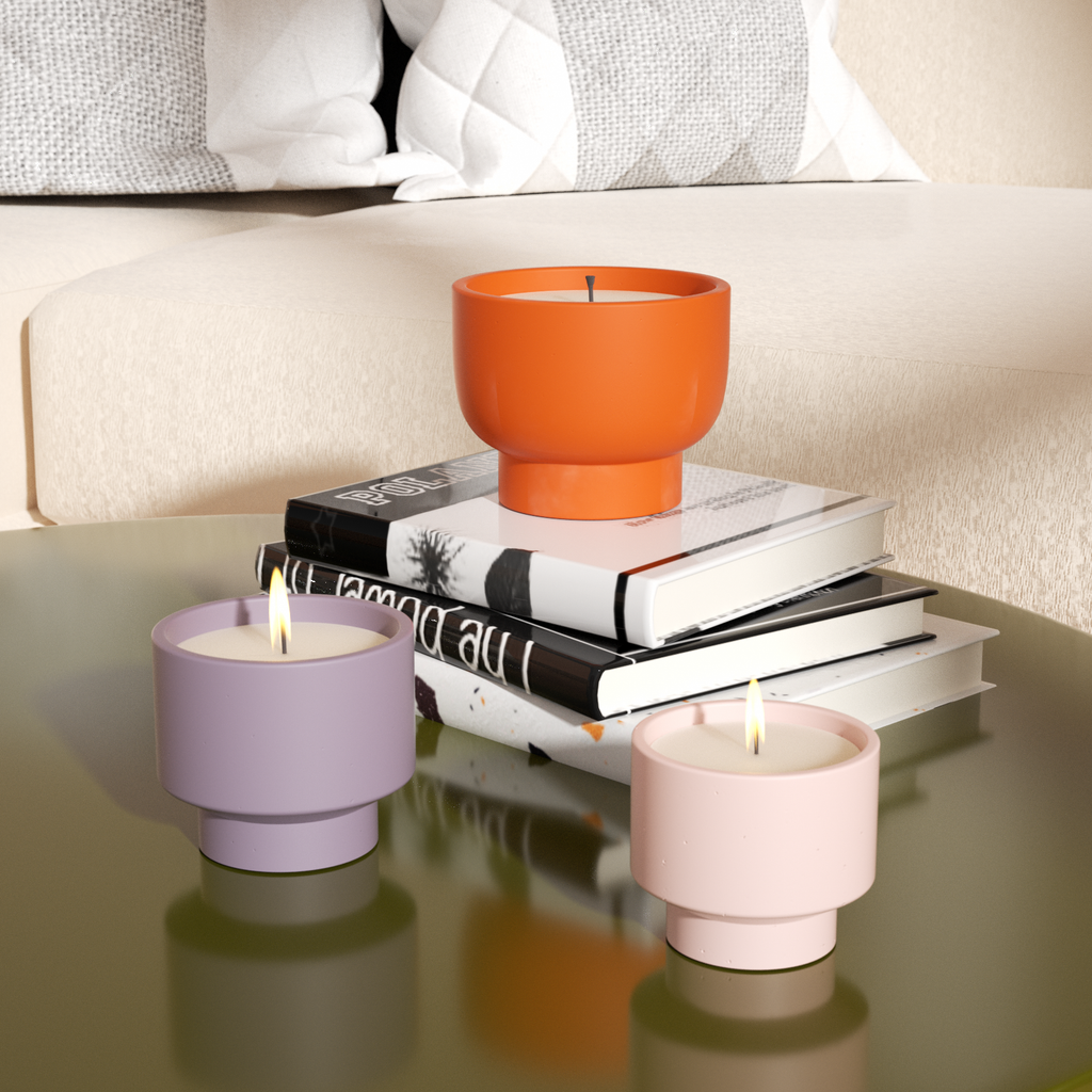 The orange, purple and pink Concrete Plant Pot is placed on the table and used as a candle jar-Boowan Nicole