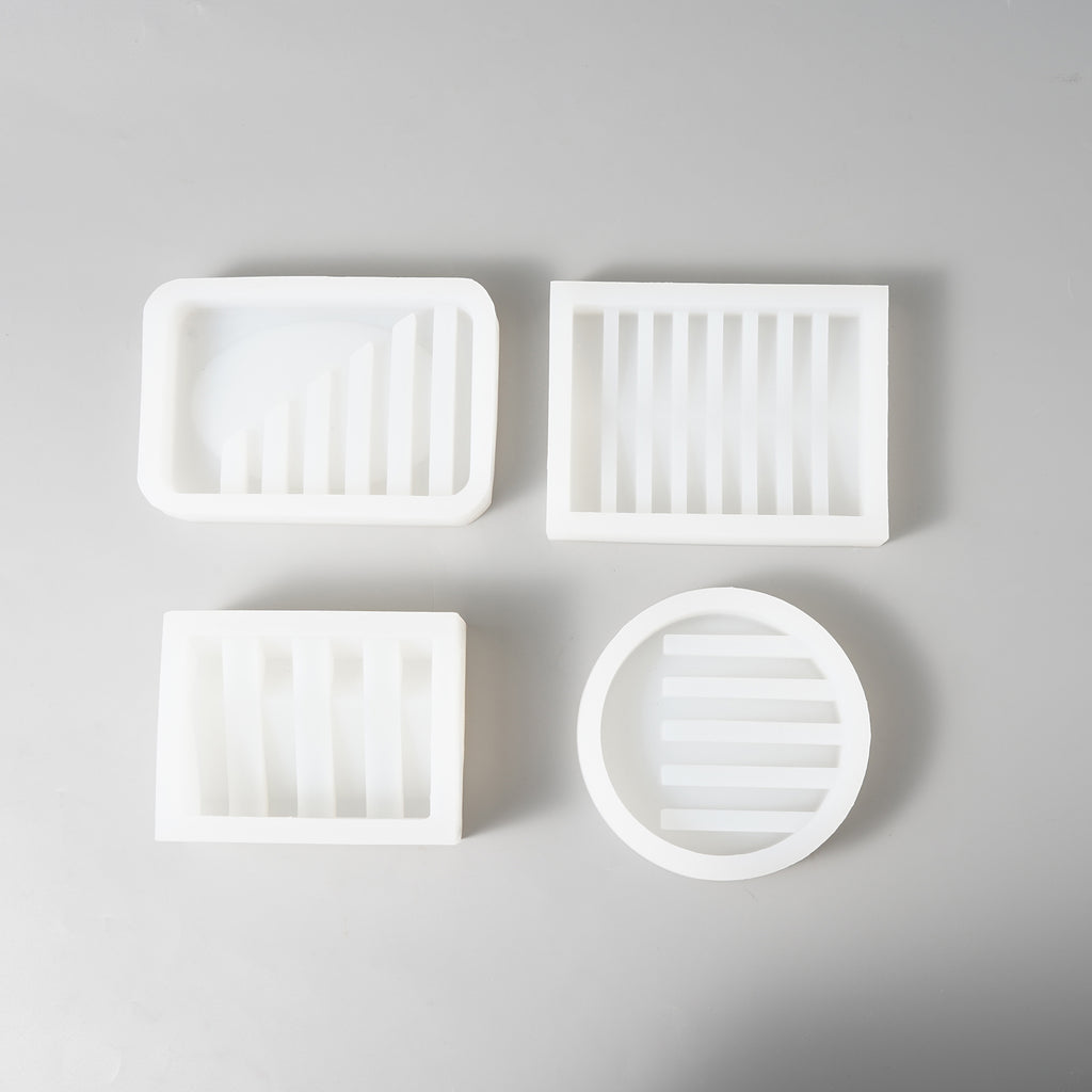 Explore the versatility of Boowannicole's Silicone Mold collection – a static display featuring four distinctive soap dish molds.