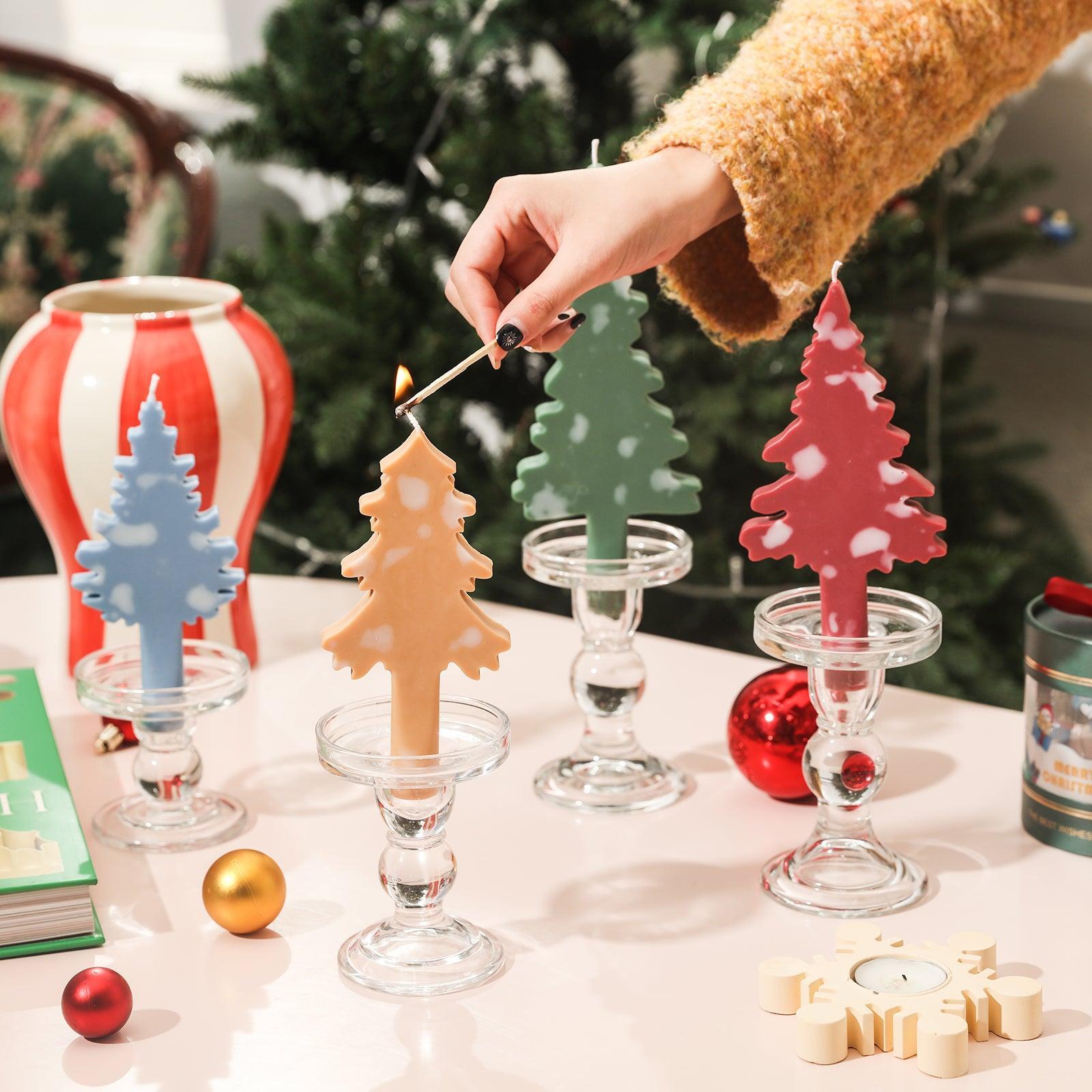 Light Christmas candles in crystal candle holders.