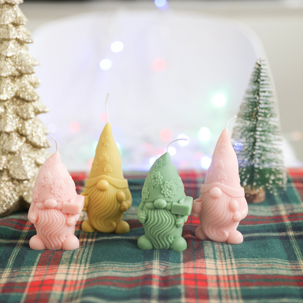 Four Christmas Floral Hat Gnome Candles placed on the table - Boowan Nicole