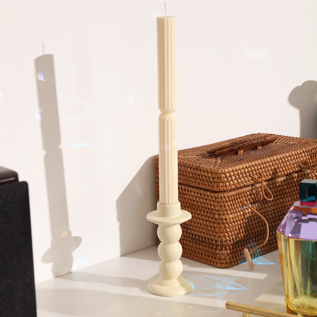 White Doric Pillar Taper Candle placed in candle holder on dresser - Boowan Nicole